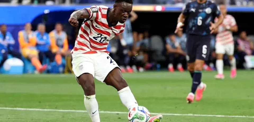 Player kicking the ball during a soccer match