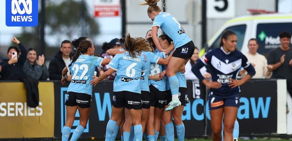 Players celebrating a goal during a match
