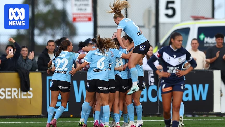 Players celebrating a goal during a match