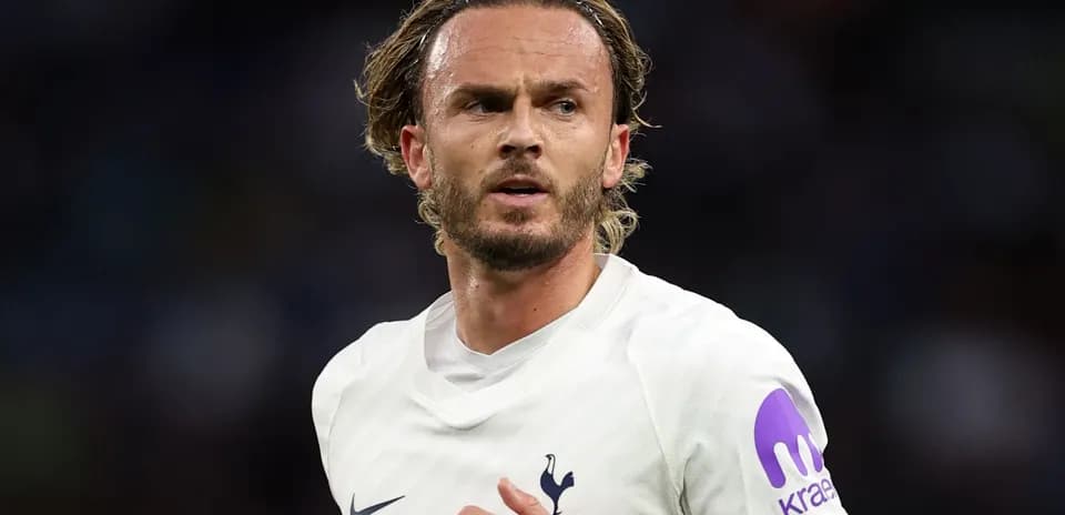 Player wearing Tottenham kit during match action