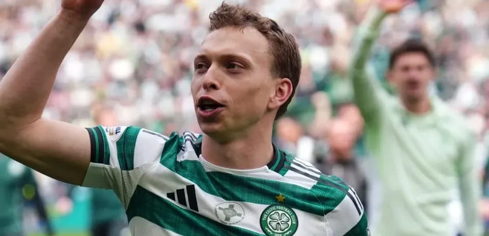 Celtic player celebrating with fans in stadium