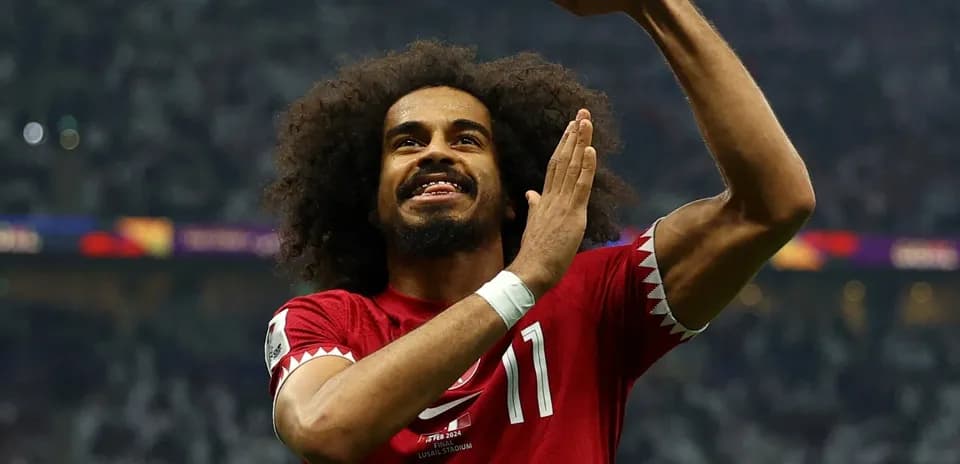 Qatari player celebrating during football match