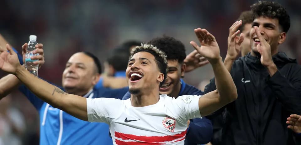 Players celebrating victory with arms raised