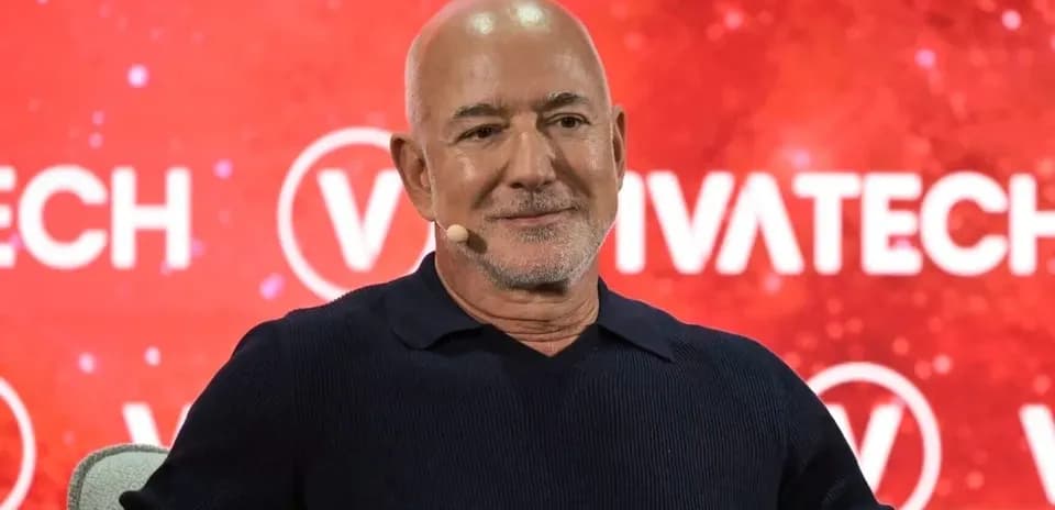 Speaker at VivaTech conference with red backdrop
