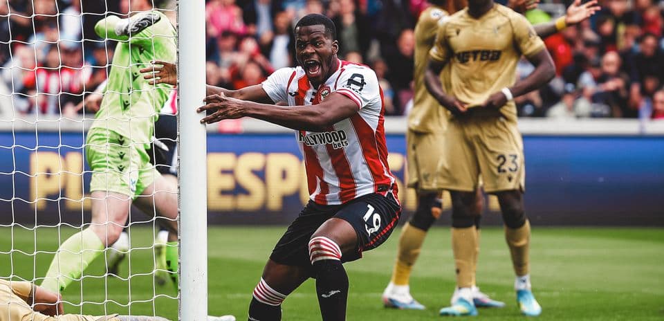 Brentford player celebrating near goalpost