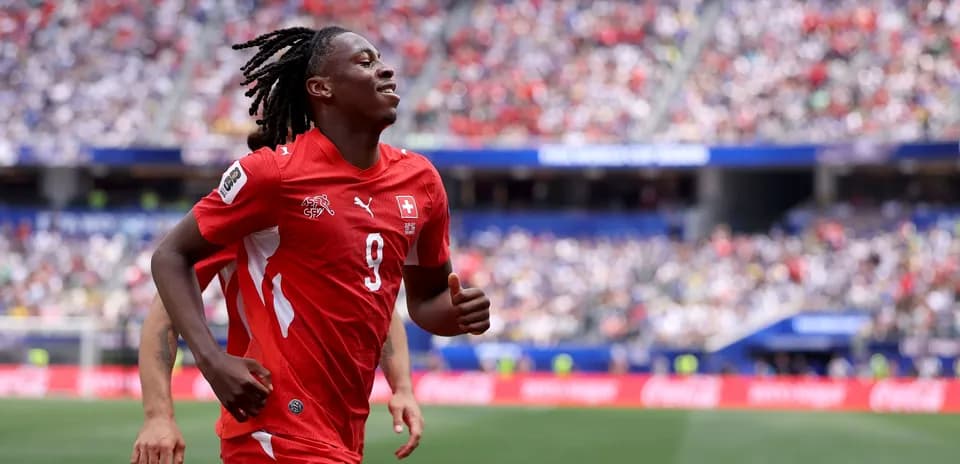 Player celebrating during a match in red uniform