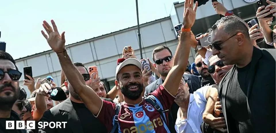 Player greeting fans upon arrival at the airport