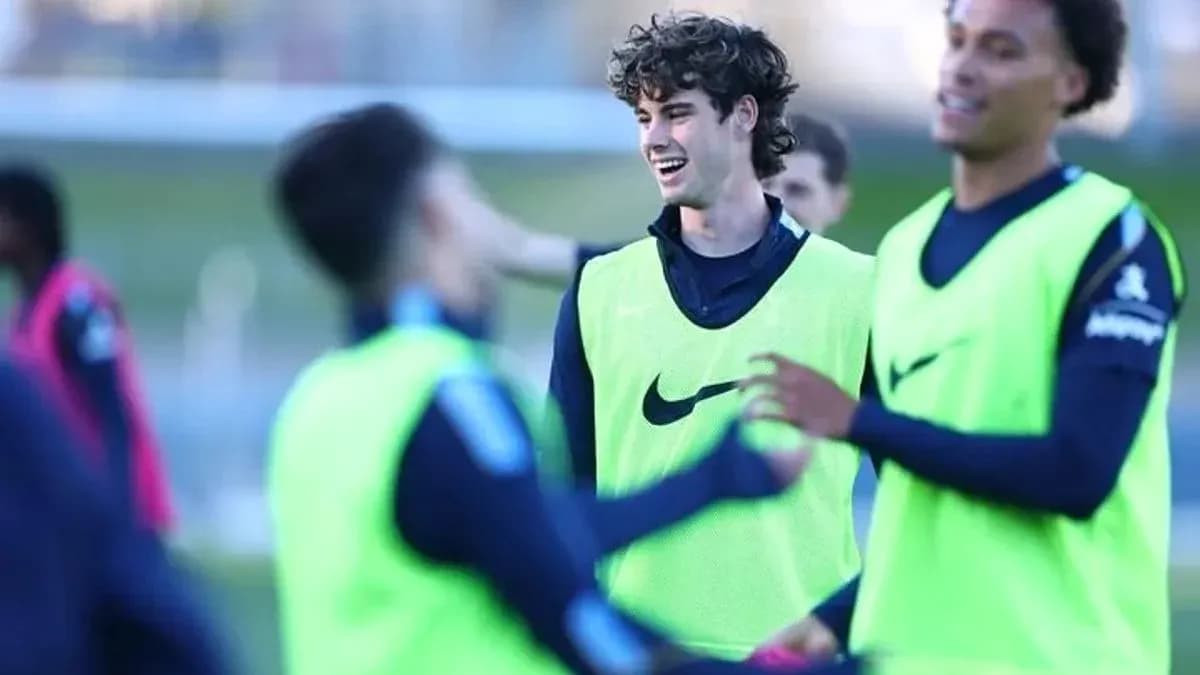 Players training and interacting on the pitch