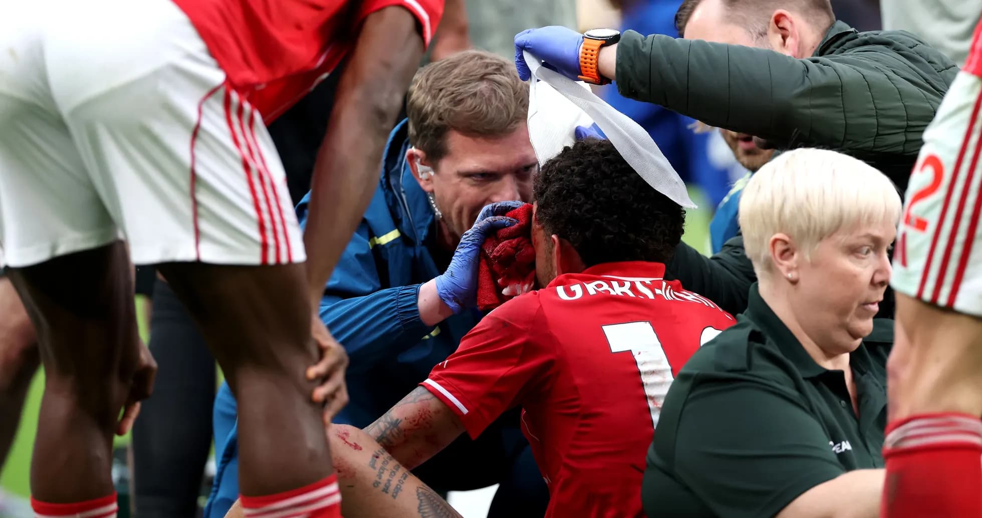 Medical staff attending to injured player on field