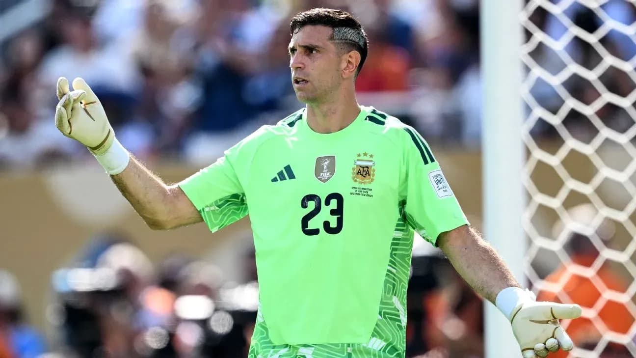 Goalkeeper in green uniform gesturing during match