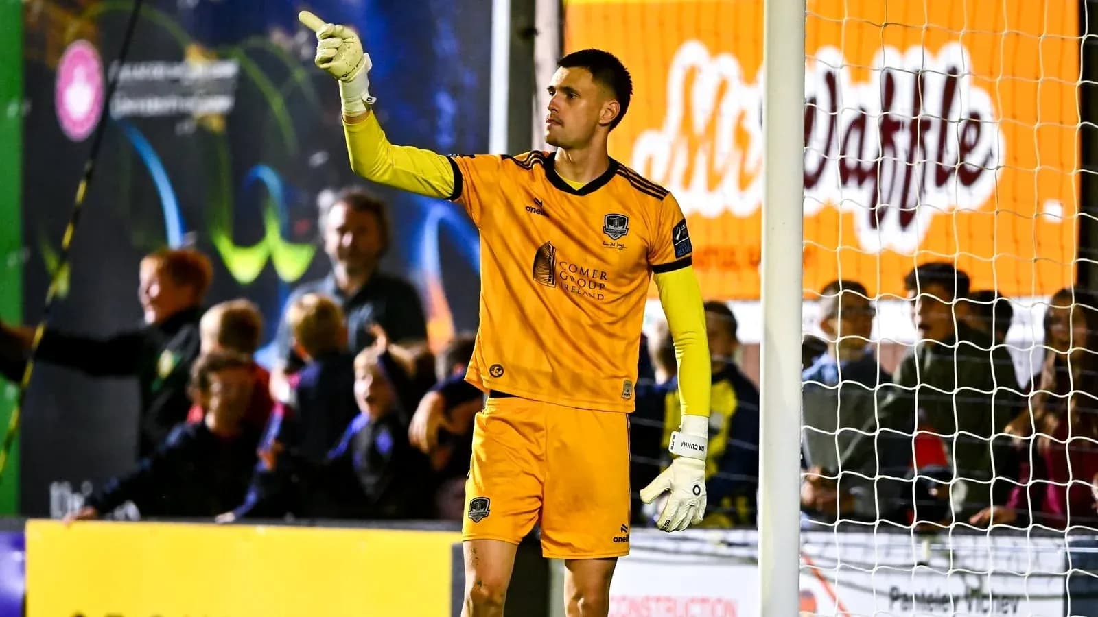 Goalkeeper signaling to teammates during a match