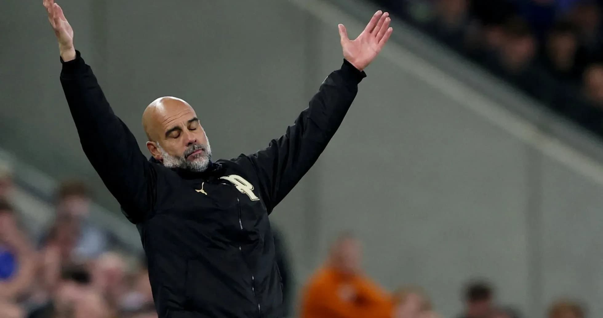 Manager gesturing during match on the sidelines