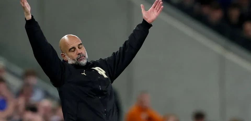 Manager gesturing during match on the sidelines