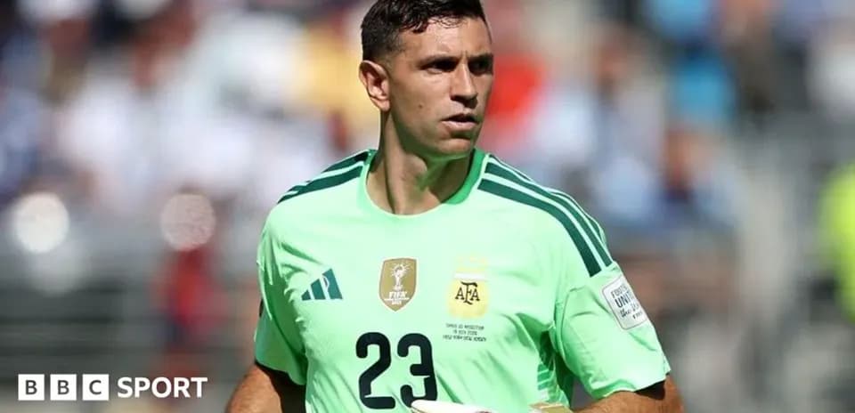 Goalkeeper wearing green jersey during match warm-up