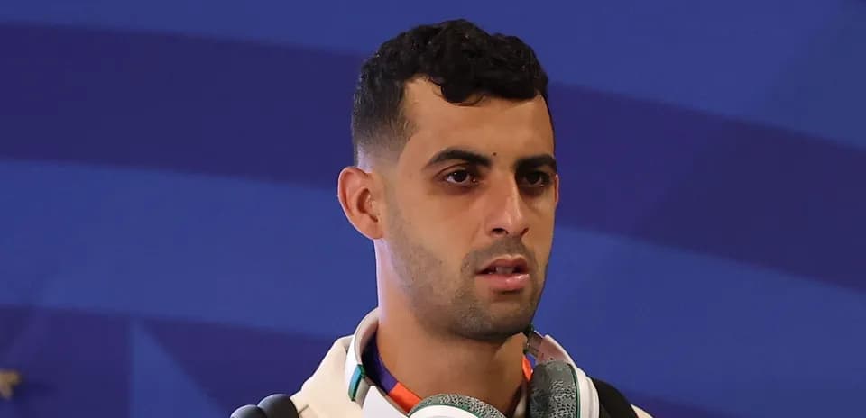 Player wearing headphones, preparing for event
