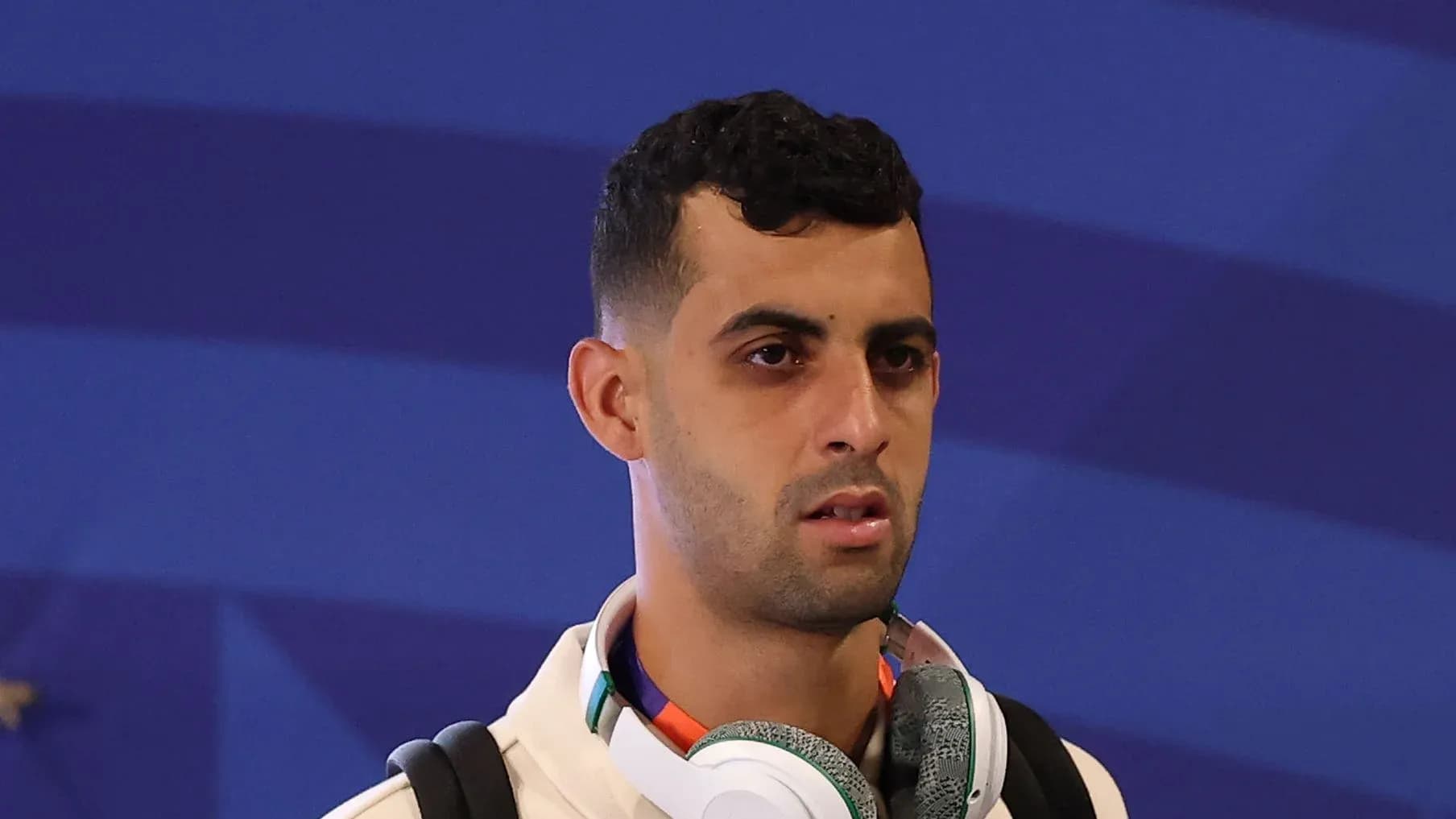 Player wearing headphones, preparing for event