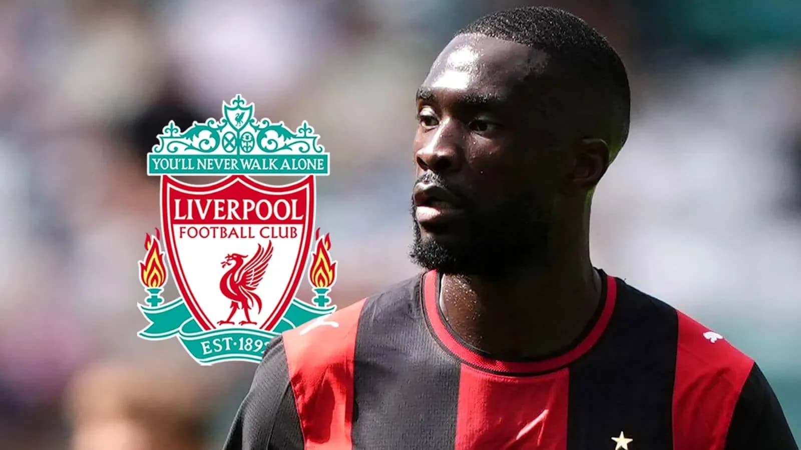Player in jersey with Liverpool logo in background