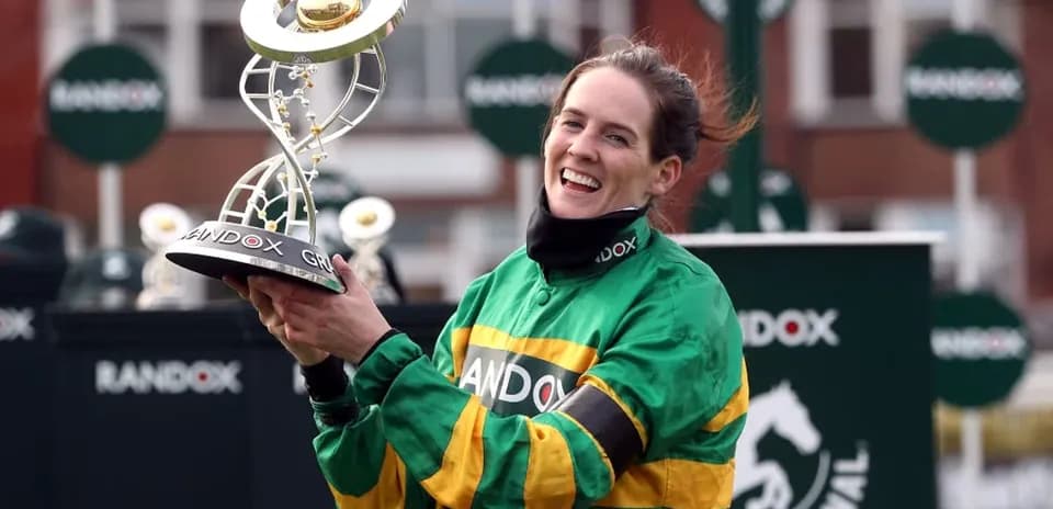 Jockey celebrating with trophy at racing event