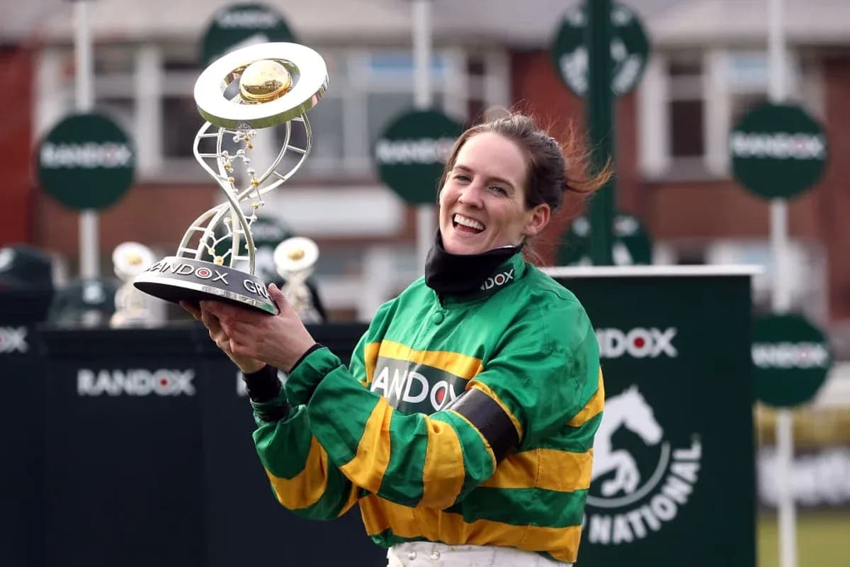 Jockey celebrating with trophy at racing event