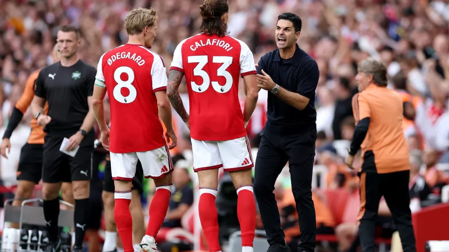 Arsenal players and manager during substitution discussion Arsenal players and manager during substitution discussion