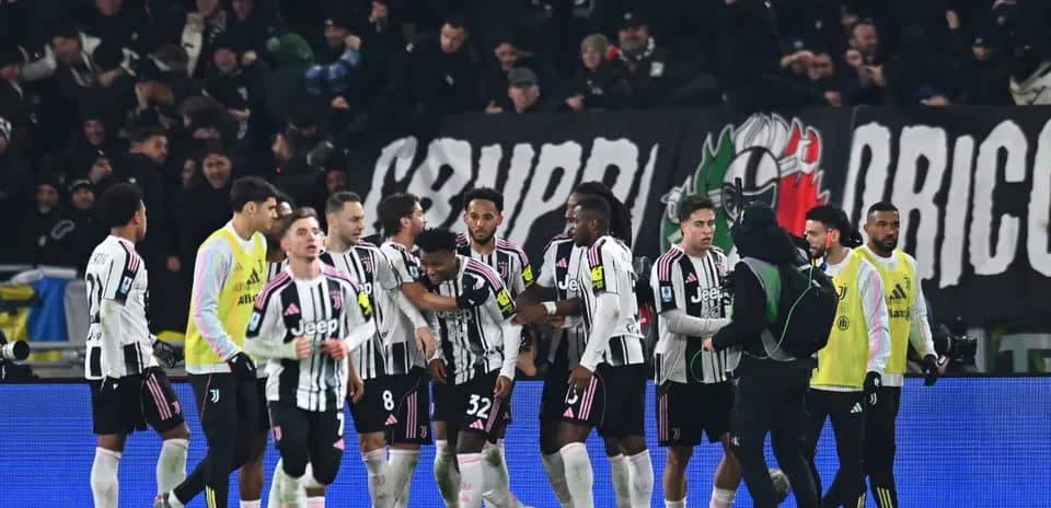 Juventus players celebrating with fans after match