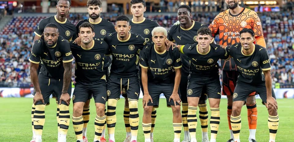 Football team posing for a group photo on field