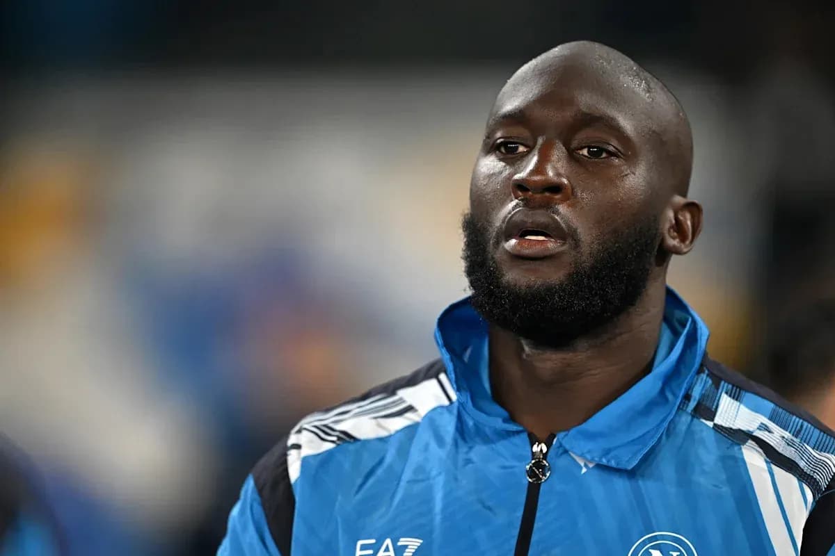 Player wearing blue training jacket on the field