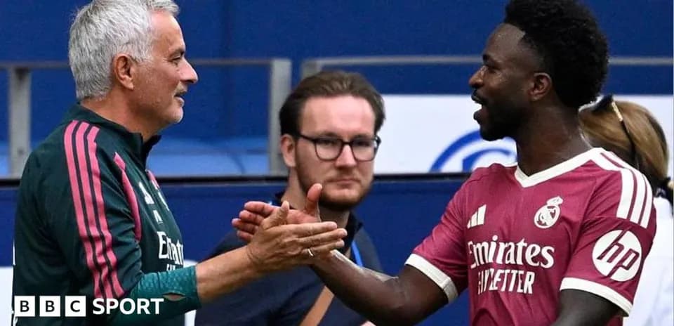 Coach and player shaking hands on the sidelines
