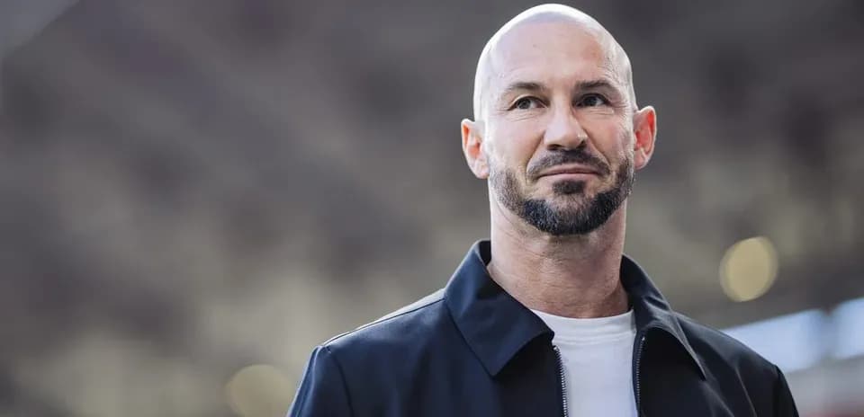 Man with beard and shaved head, outdoors