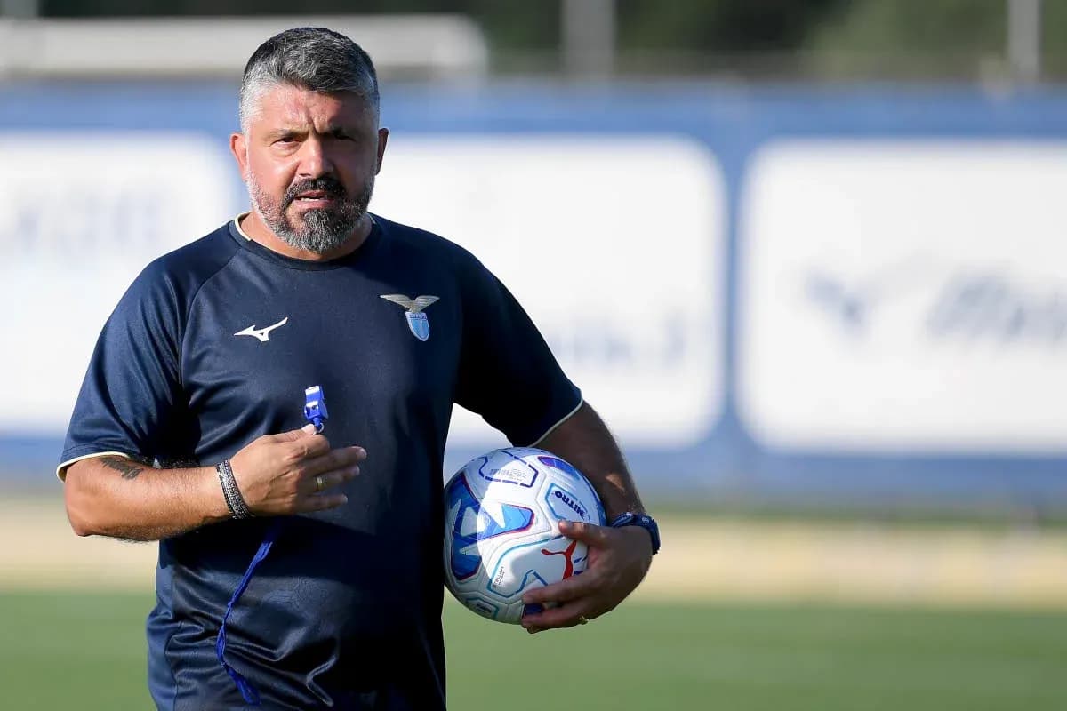 Coach holding a ball during training session
