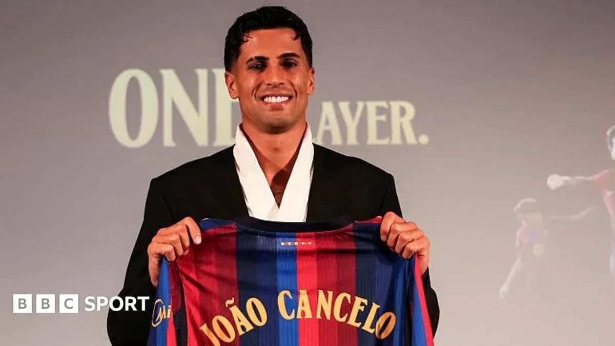 Player holding FC Barcelona jersey at presentation
