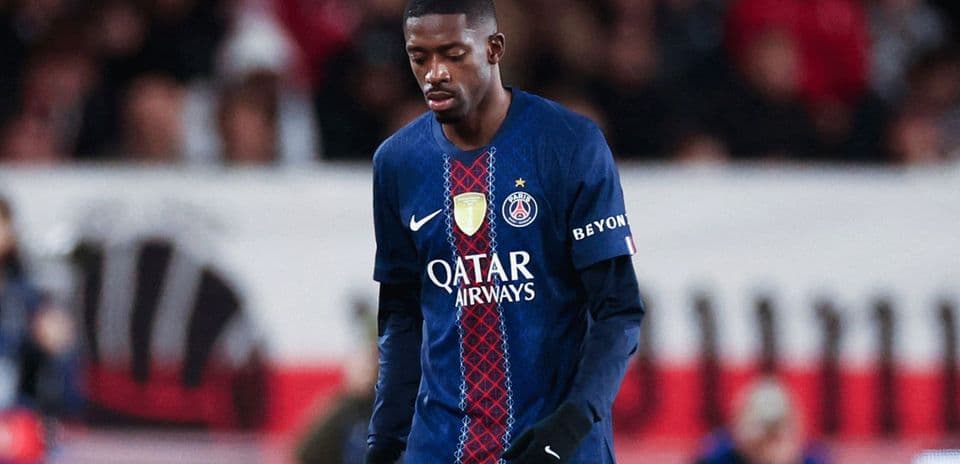 Player in PSG jersey walking on the field