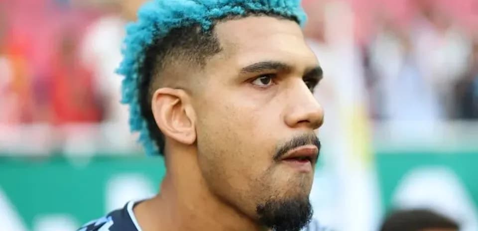 Player with blue hair during pre-match warm-up