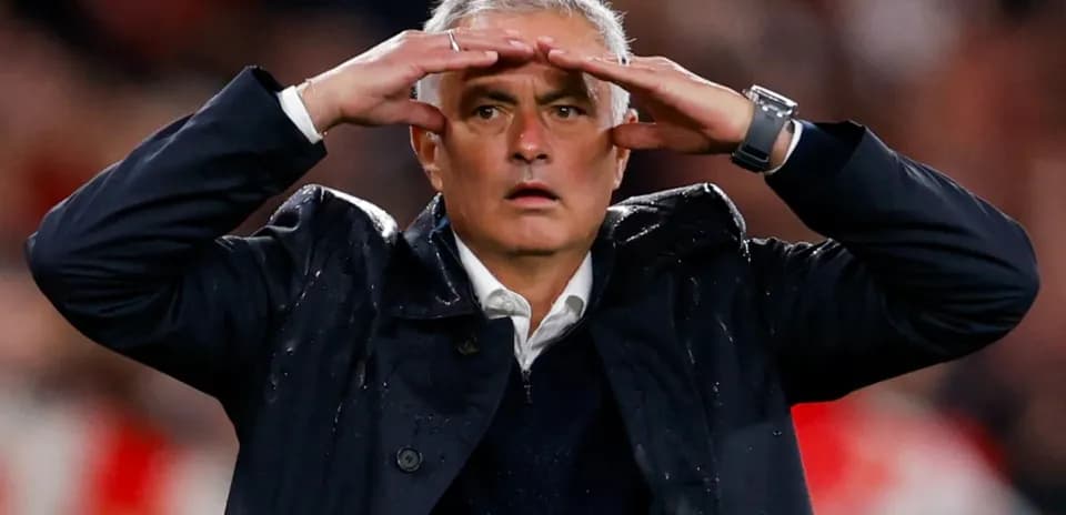 Coach gesturing during a match on the sidelines