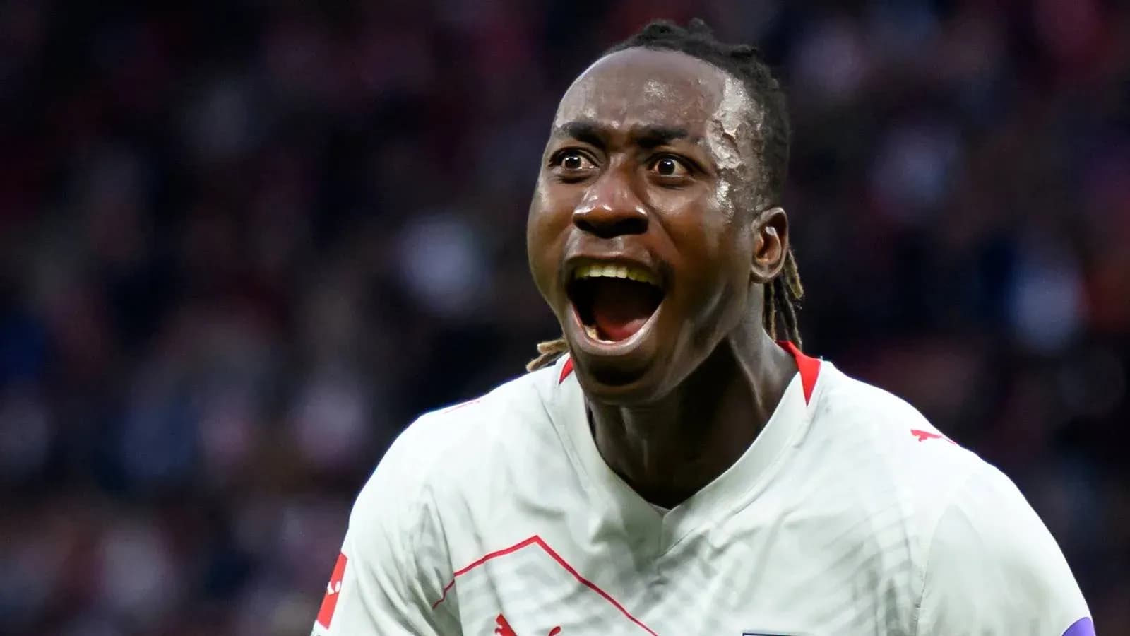 Player celebrating passionately after scoring a goal