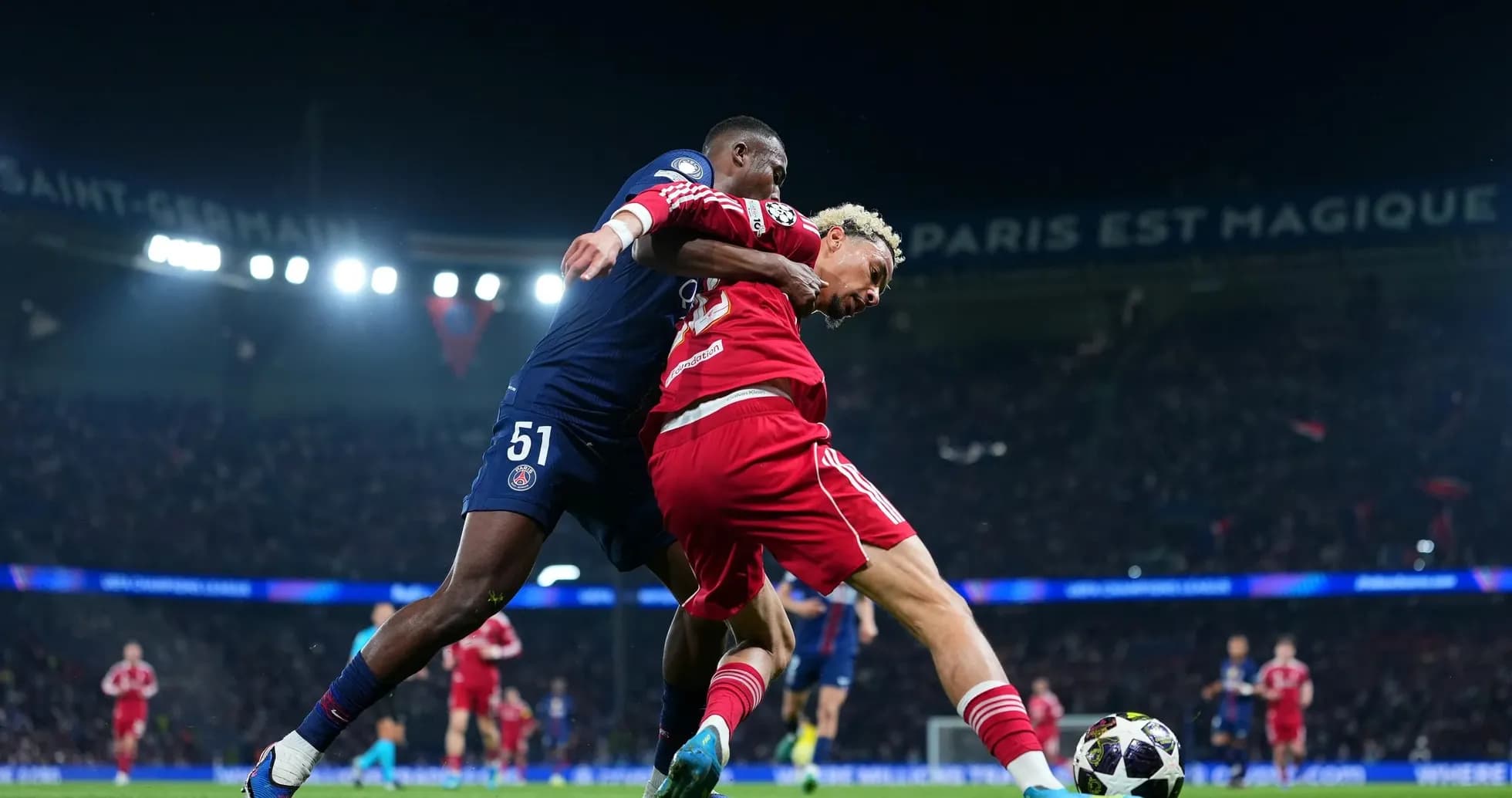 Player challenge during PSG vs Liverpool match