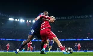 Player challenge during PSG vs Liverpool match