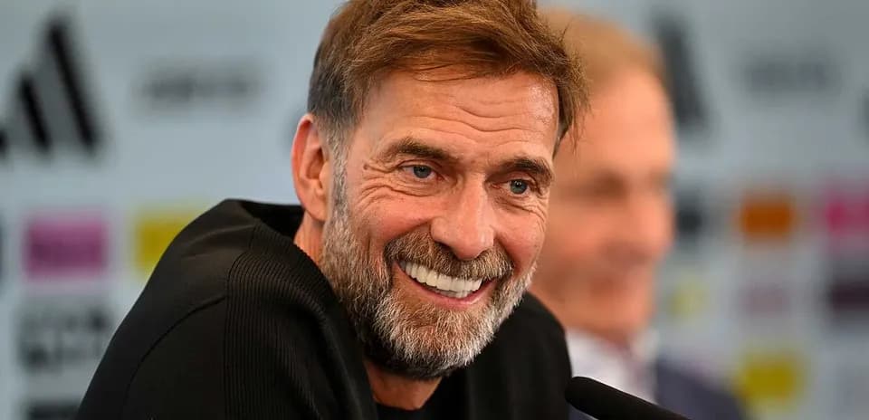 Manager smiling during press conference event