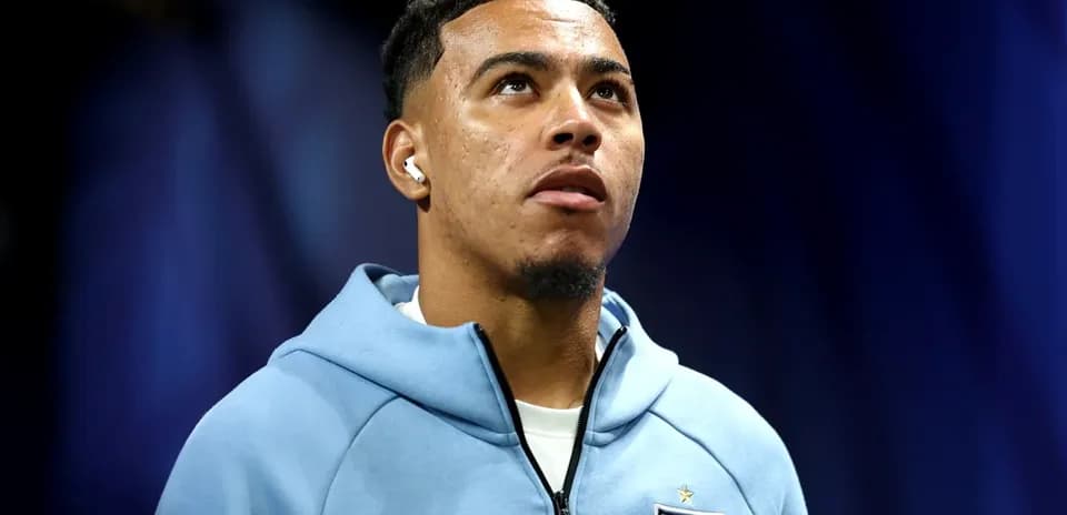 Player in England jersey looking upwards during event