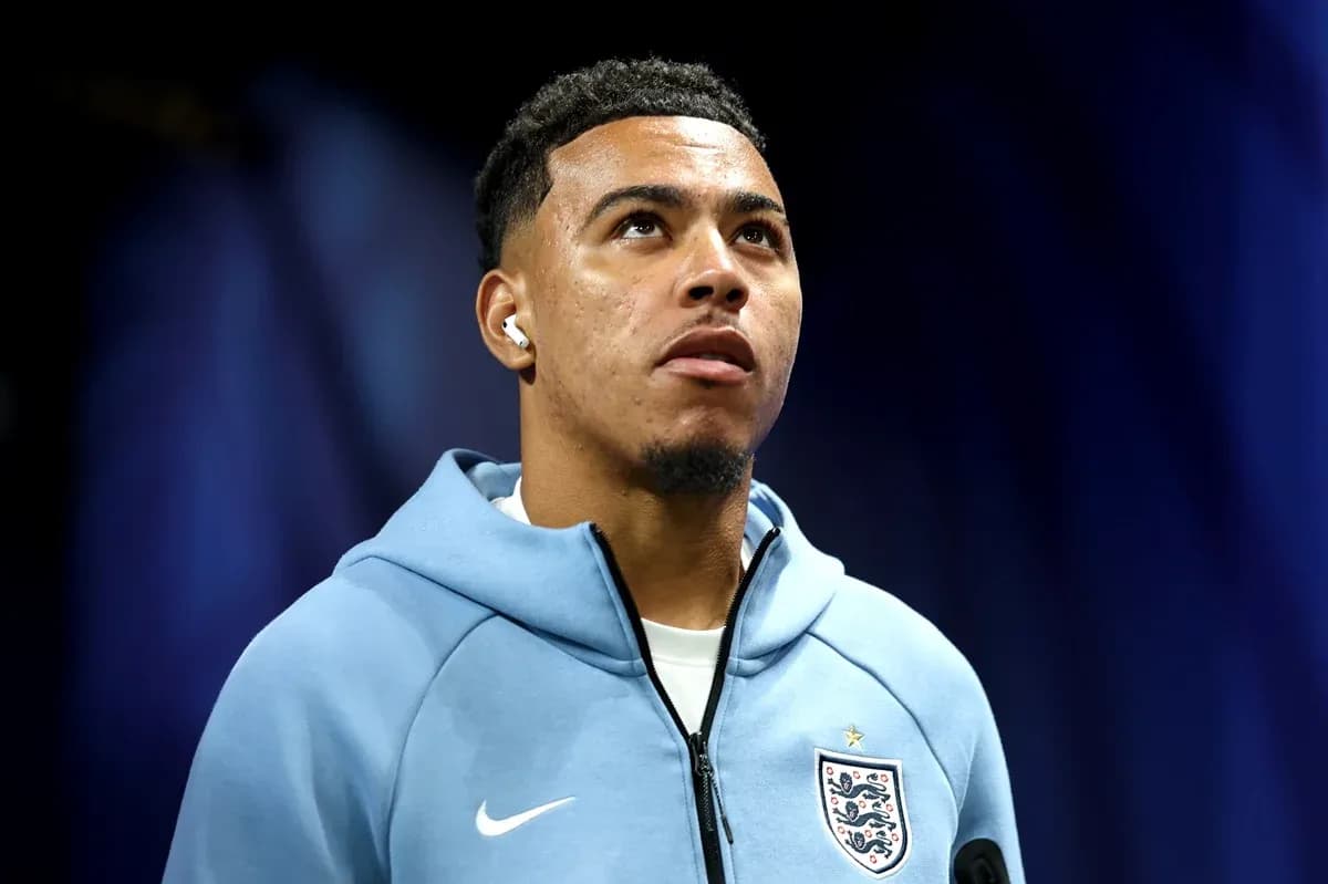 Player in England jersey looking upwards during event