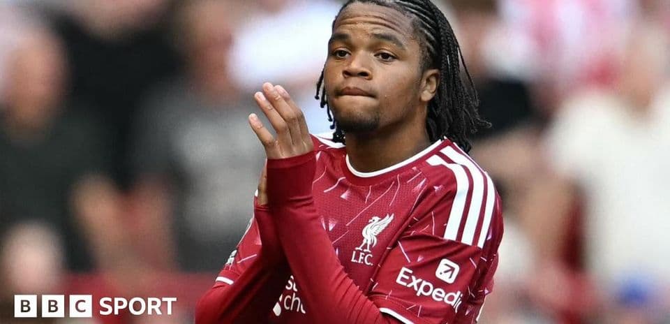 Player applauding fans during match at Anfield