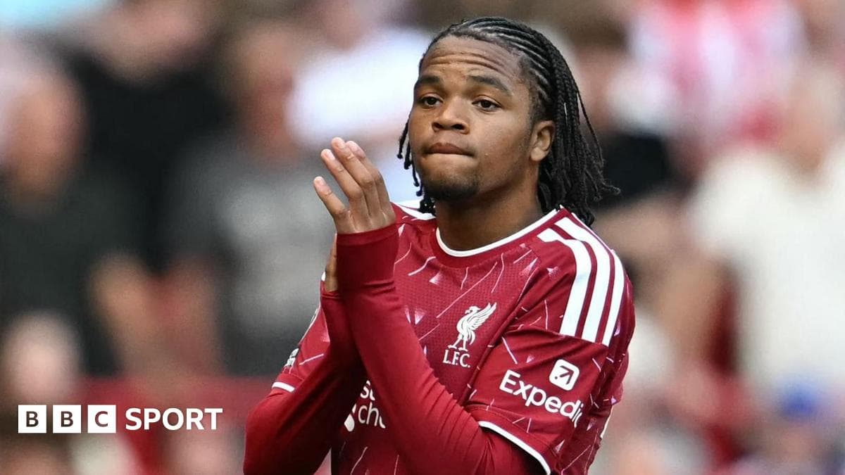 Player applauding fans during match at Anfield