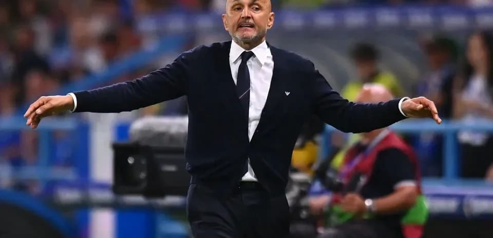 Coach gesturing during a football match on sideline