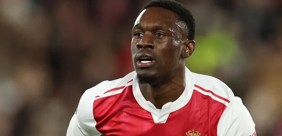 Player in AS Monaco kit running during match