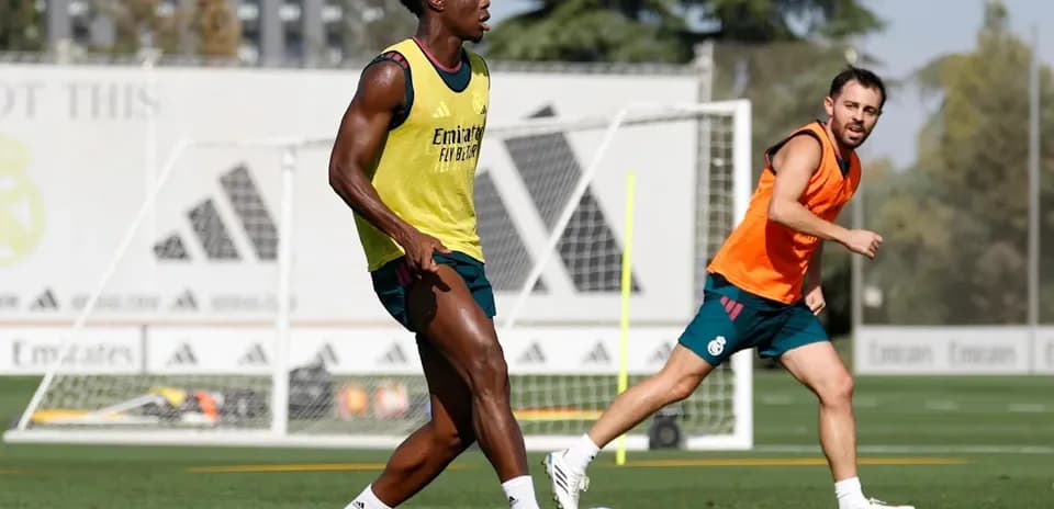 Two players training on the field during practice