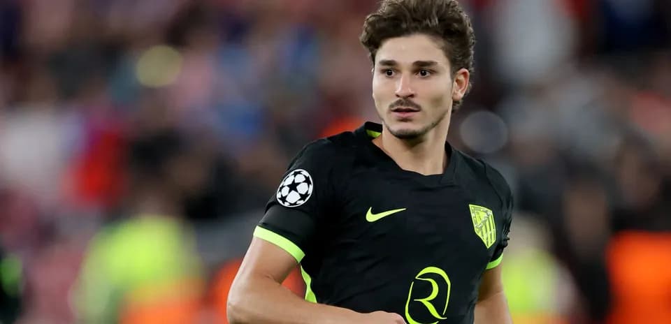 Player in black jersey during Champions League match