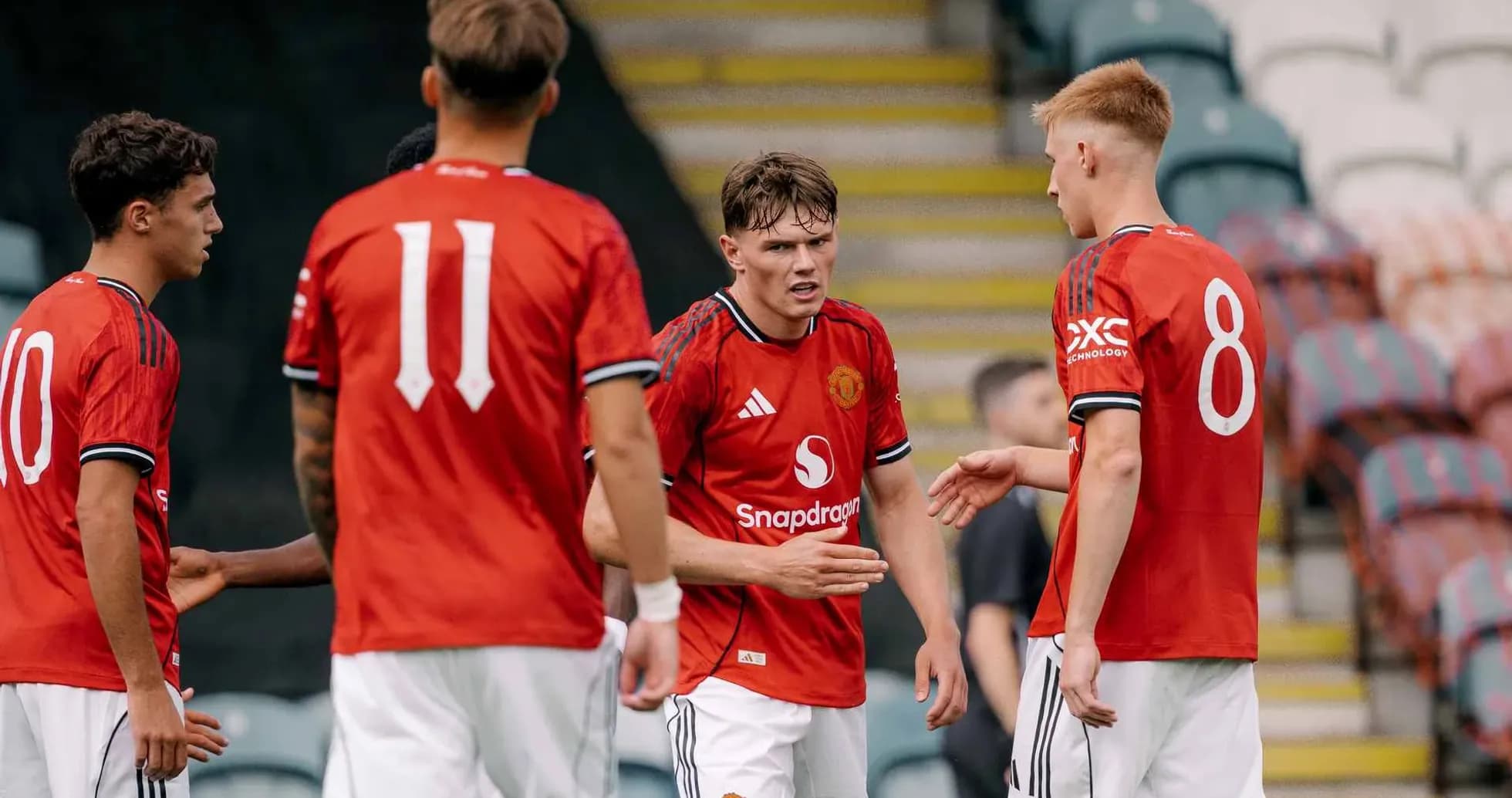 Manchester United U21 players discussing during match