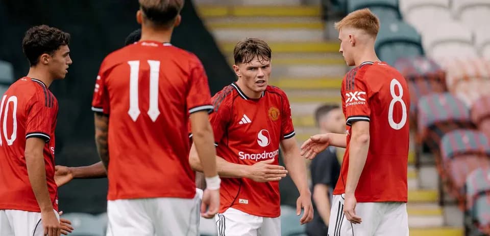 Manchester United U21 players discussing during match