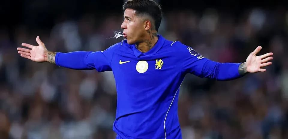 Player gesturing during a football match in blue kit