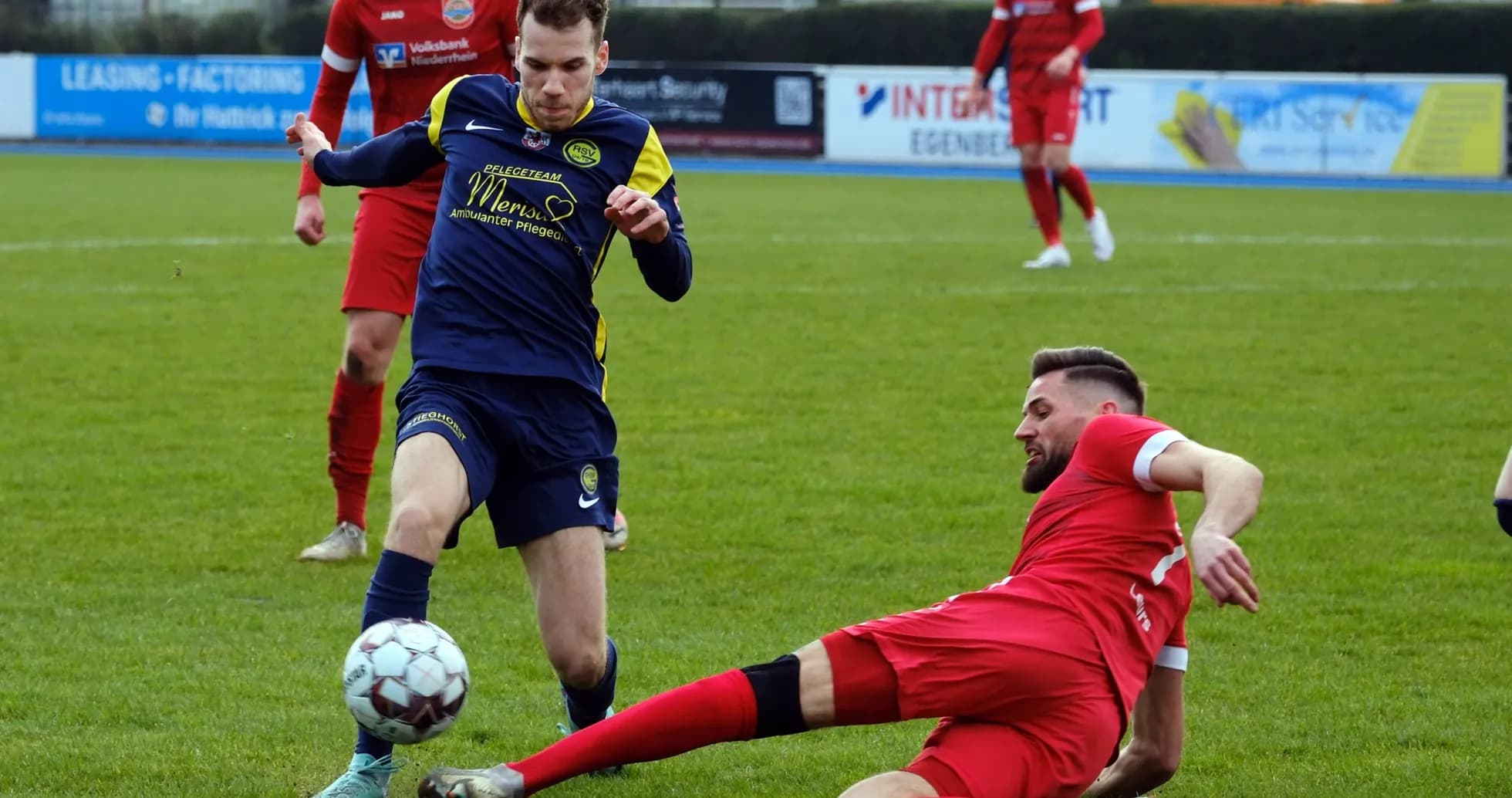 Player tackling on the field during match